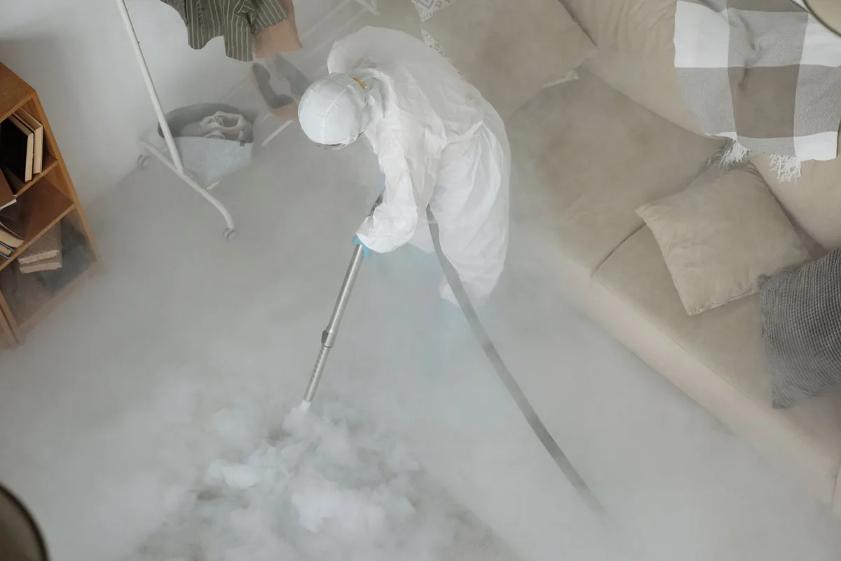 Biohazard cleanup technician in protective equipment, Westmorland, CA